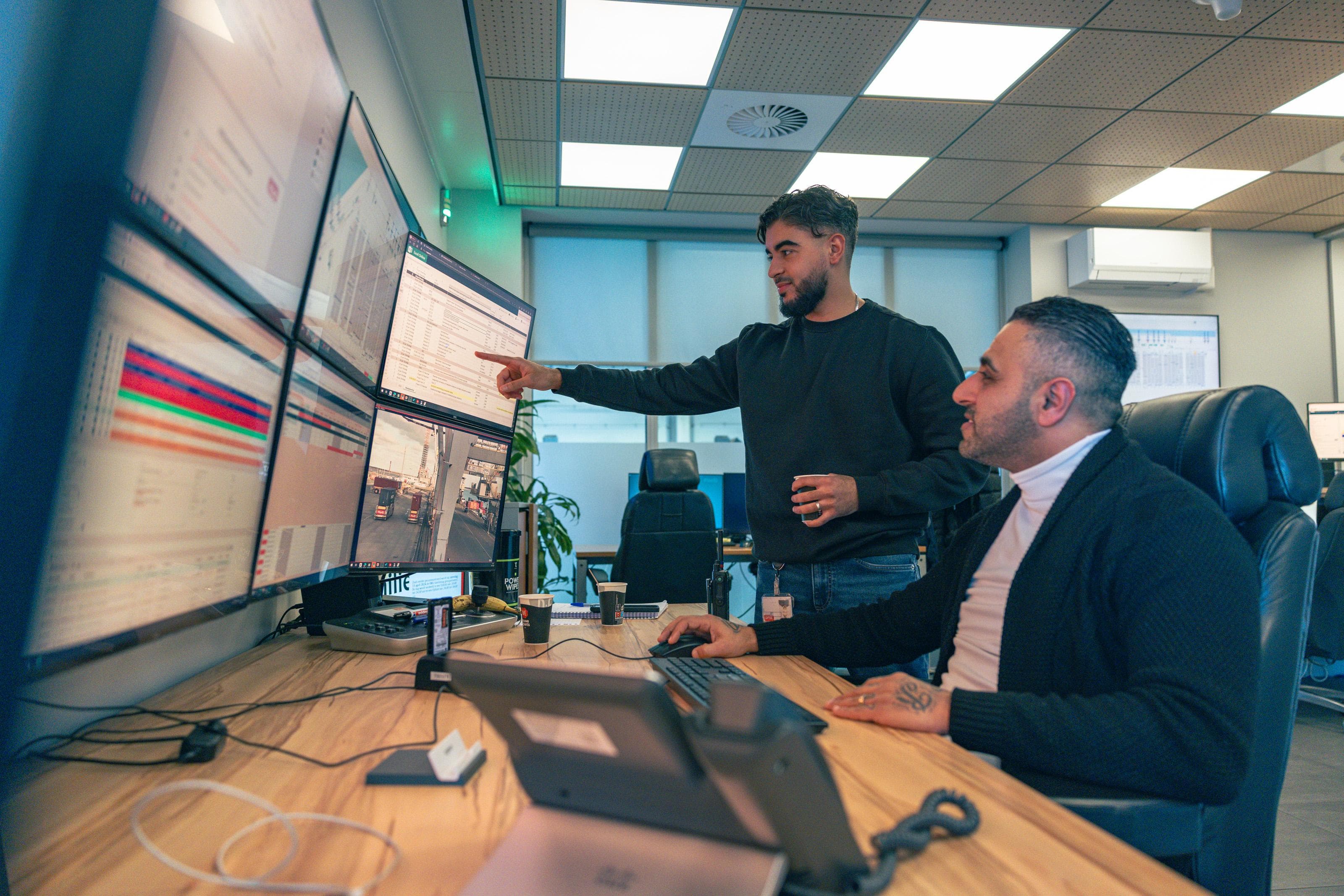 Meridian Logistics control tower team monitoring live shipment dashboards